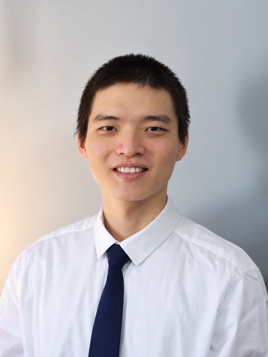 Tairan Wang in a white shirt and tie
